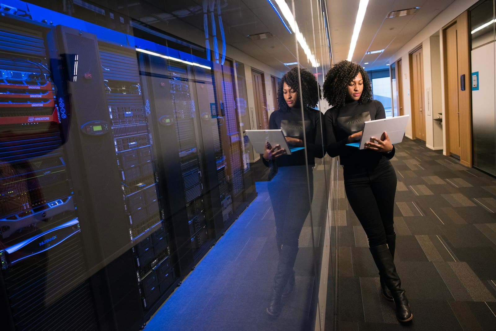 Strock Energy engineer reviewing systems beside a server room